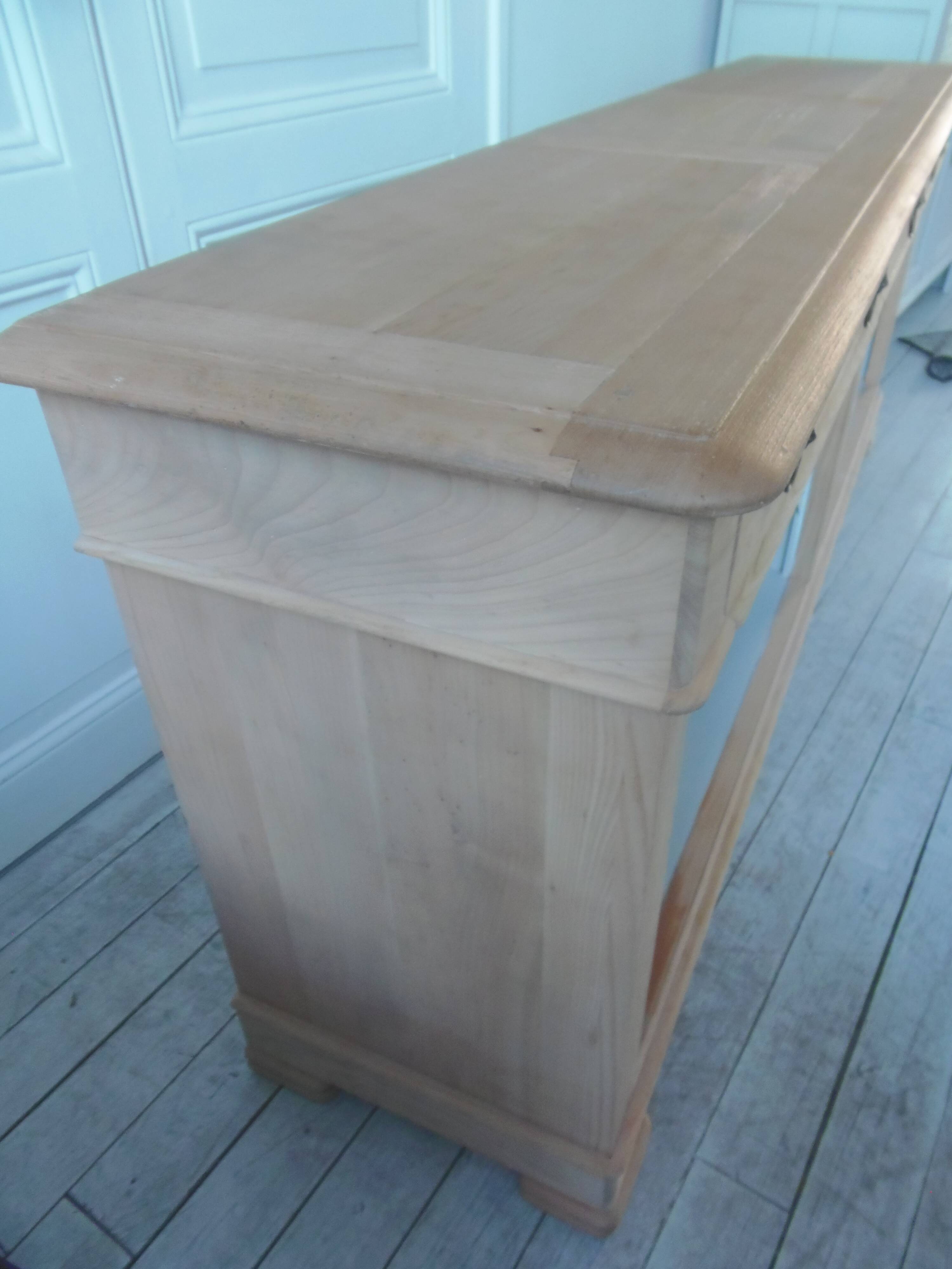 crafted dresser in raw solid wood.