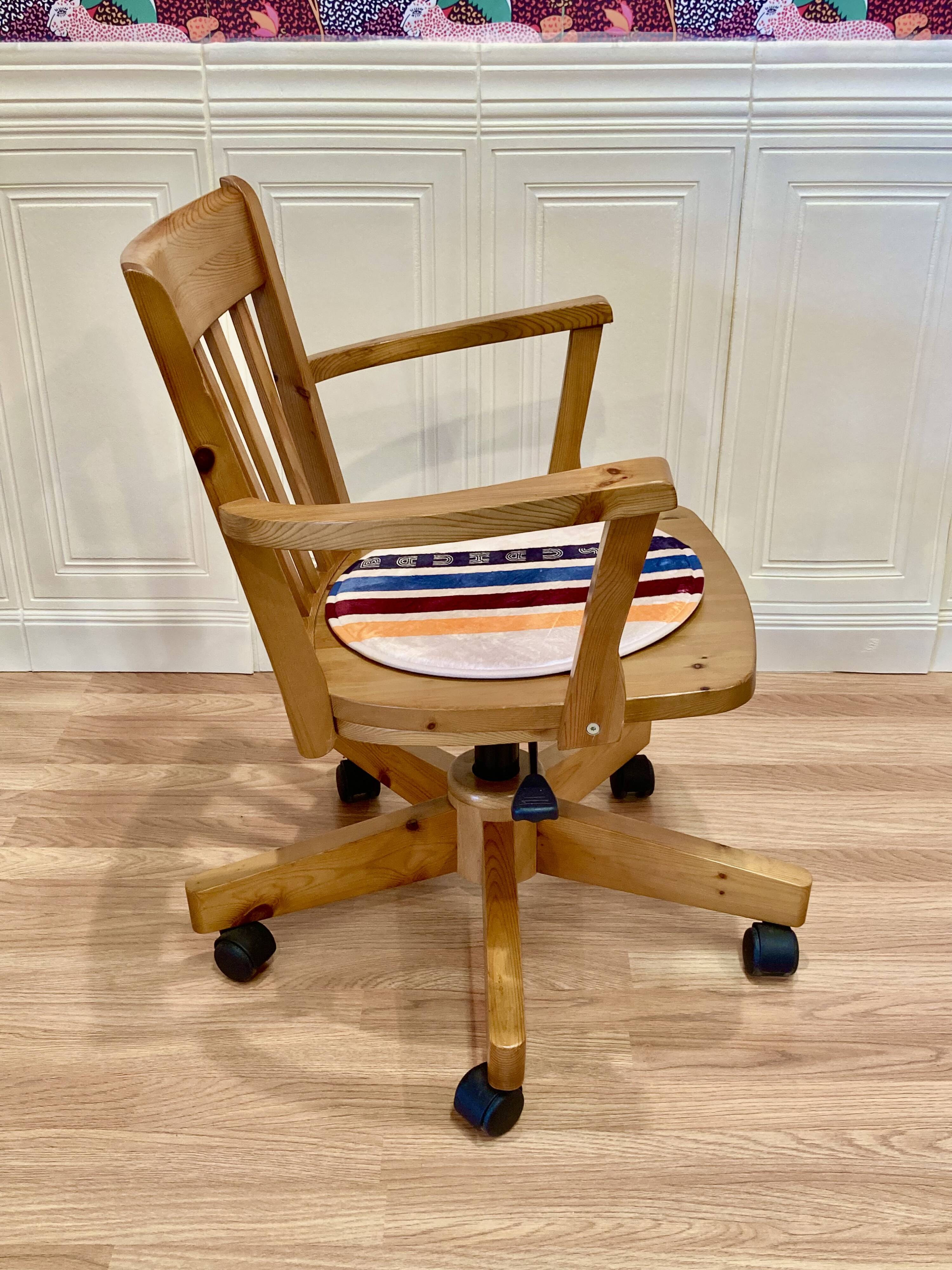 Solid wood swivel and reclining armchair.