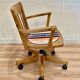 Solid wood swivel and reclining armchair.