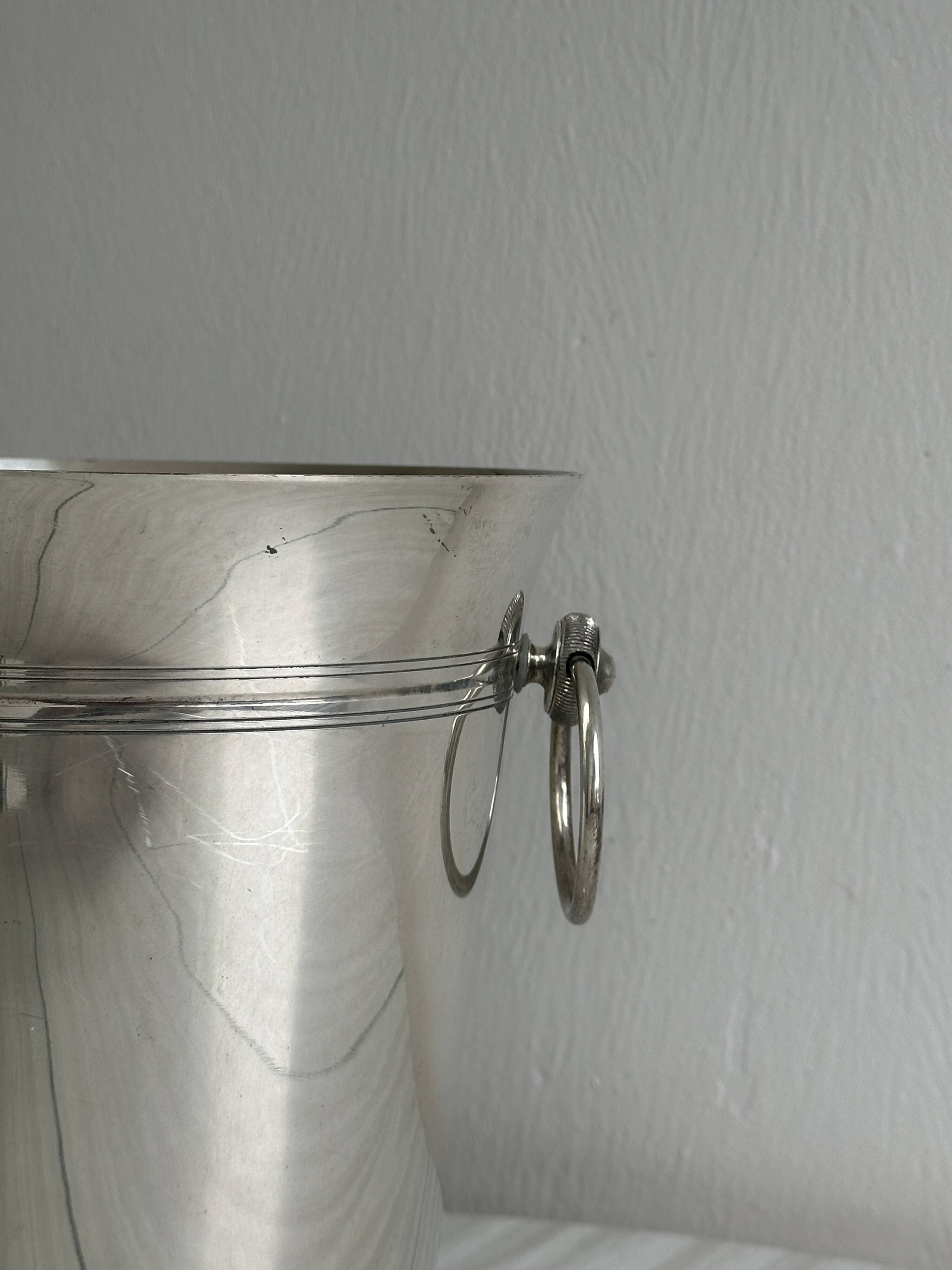 Antique champagne bucket in shiny silver metal