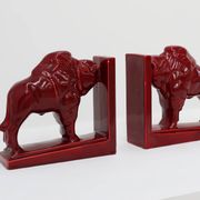 Pair of red glazed ceramic Bison ox bookends in Art Deco style, Belgium