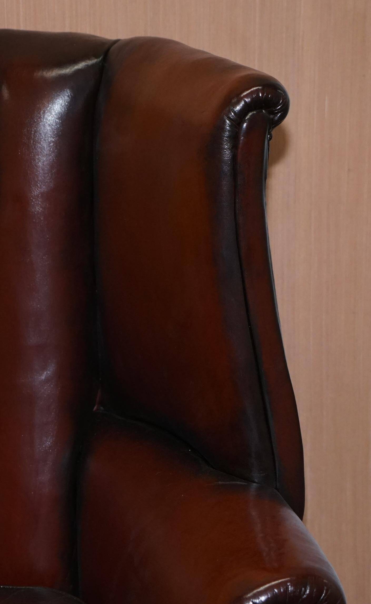 Victorian leather canapé and armchair, barrel back, circa 1860, restored.