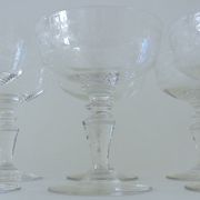 Suite of six champagne glasses on foot in engraved colorless crystal