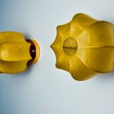 Pair of circular "cocoon" wall lights, resin and pine, Italy, 1970
