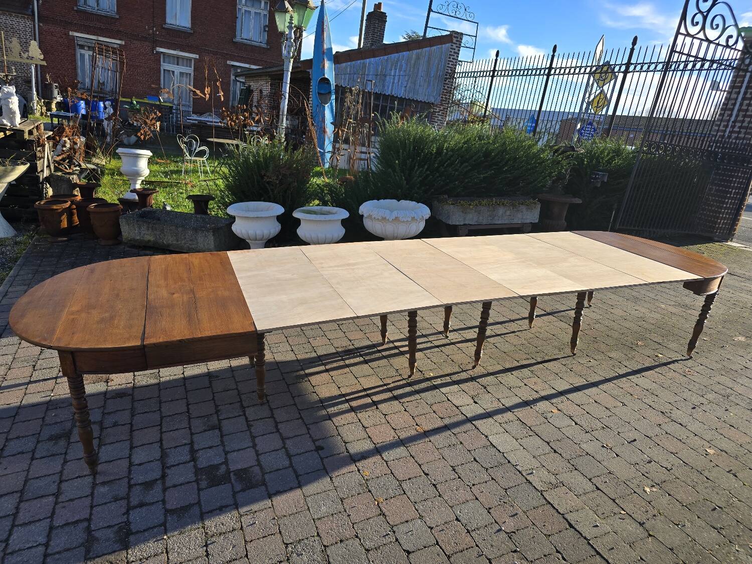 12-foot round oak table with 7 extensions / 20 people