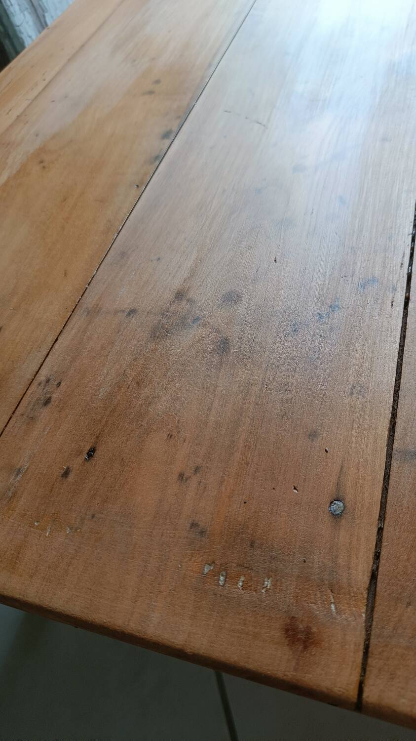 Coffee table with raw wood and a large drawer.