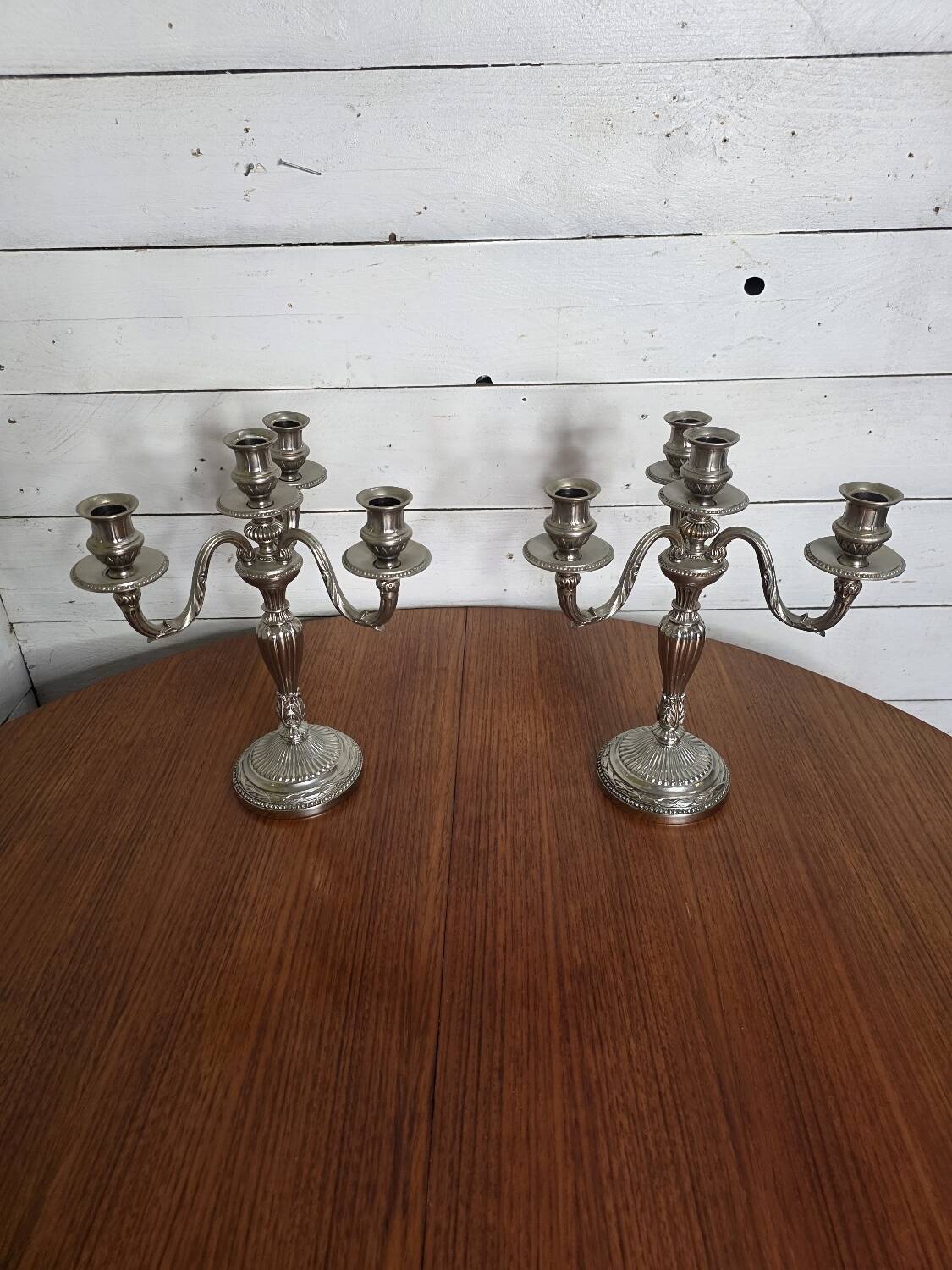 Pair of Louis XVI style candlesticks in silver-plated bronze