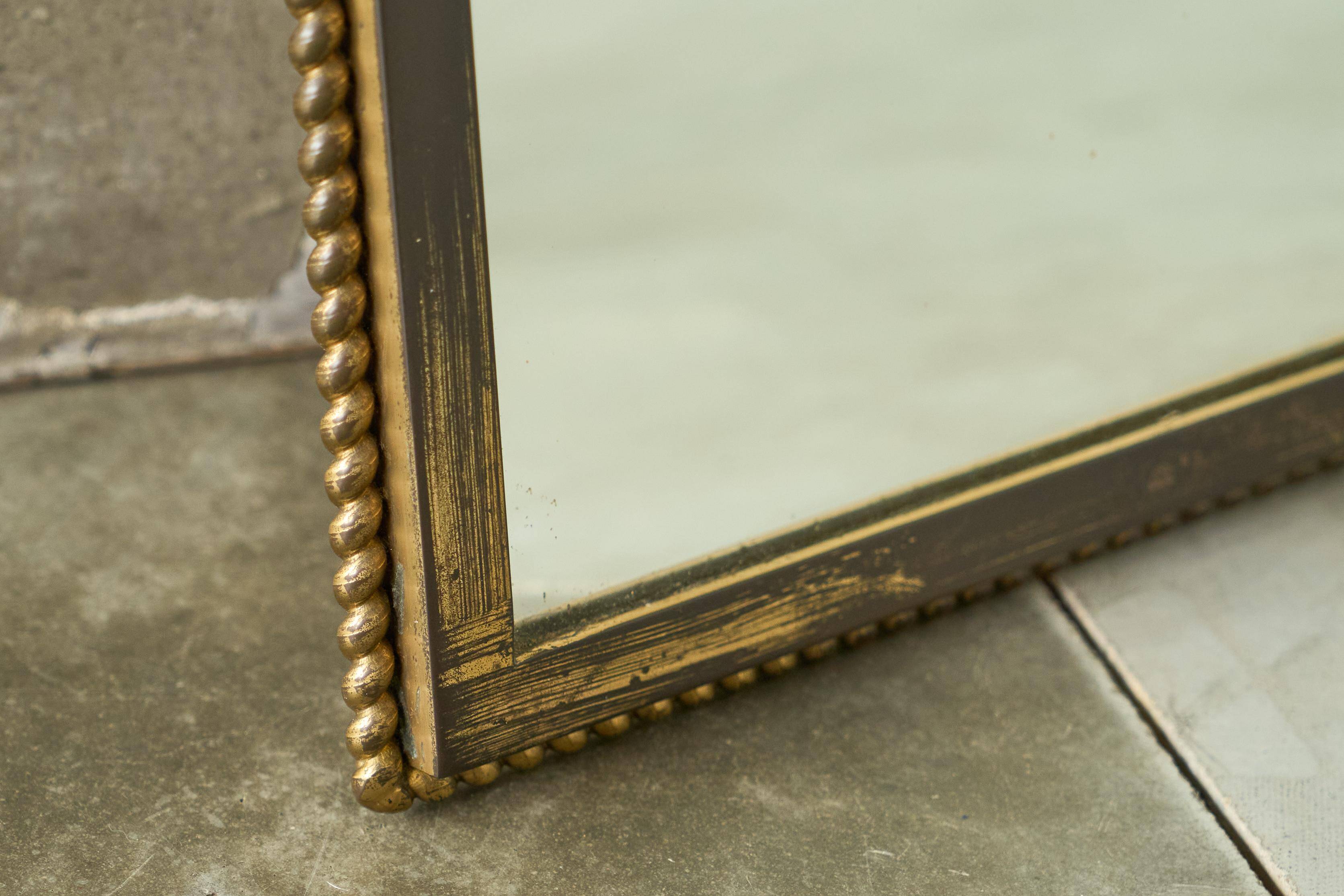 Louis XVI neoclassical mirror in patinated brass, 1960s