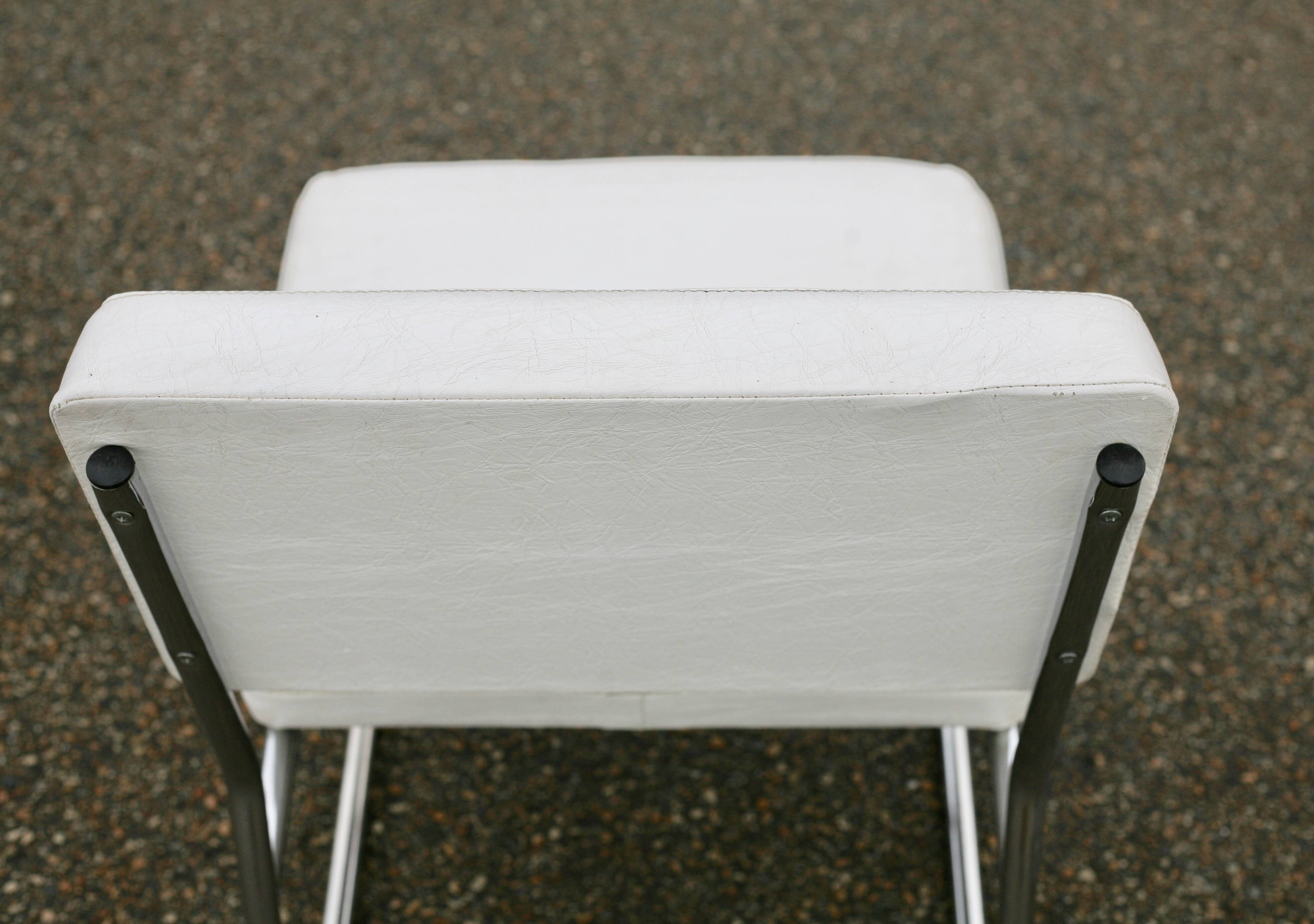 4 armchairs forming a modular sofa. Steel, imitation leather, 70s