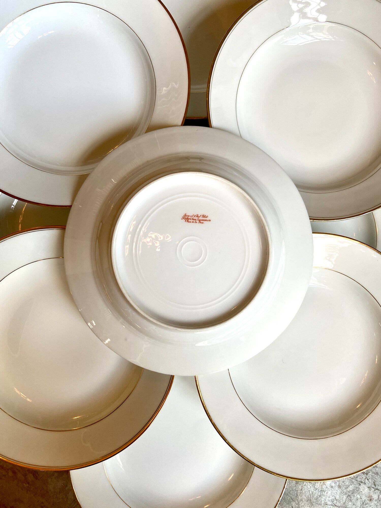 9 hollow plates in white and golden Limoges porcelain