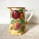 Antique pitcher in Apple slip