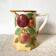 Antique pitcher in Apple slip