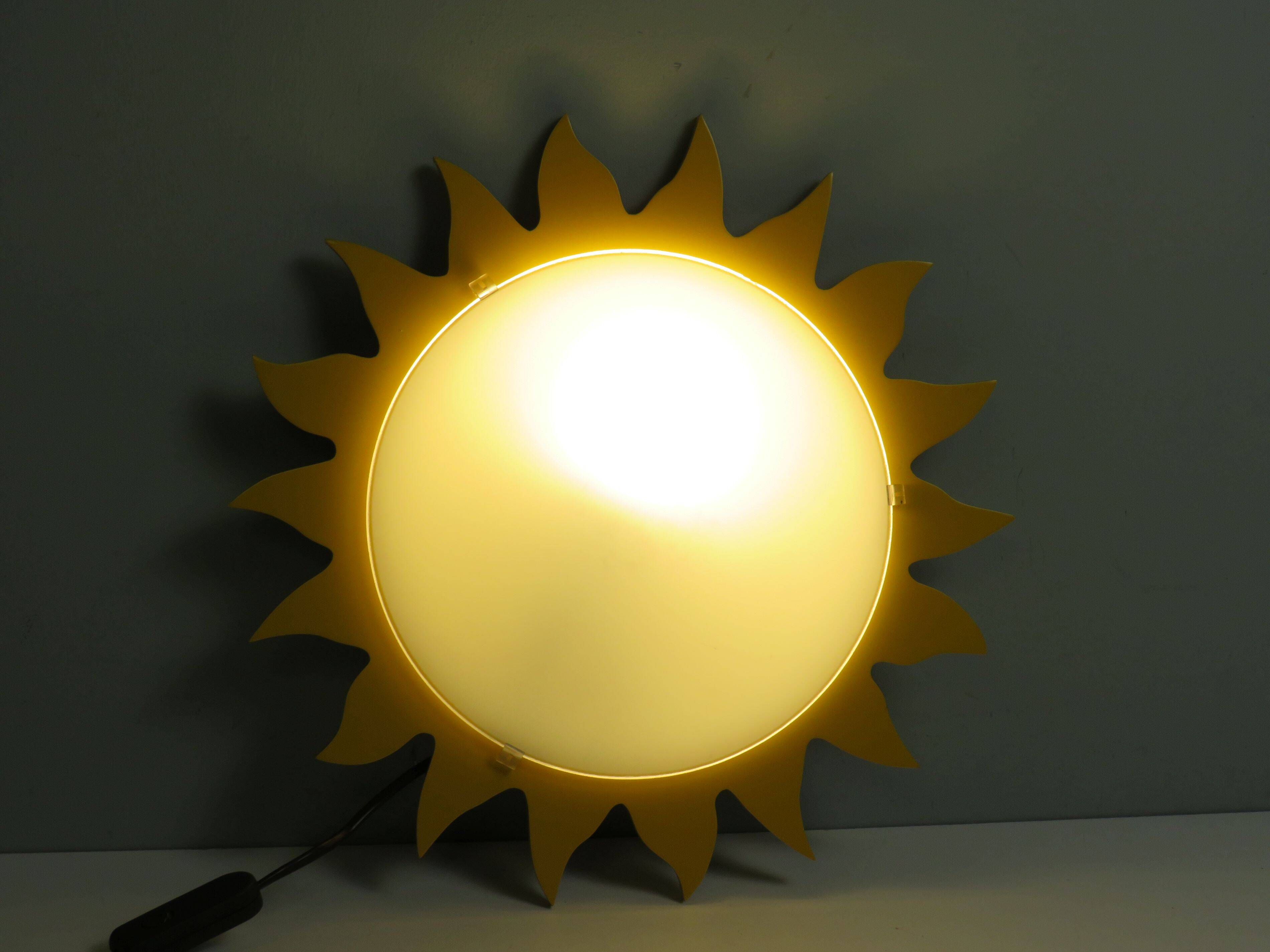 Vintage "sun" ceiling light Massive Belgium in opaline glass and lacquered wood.