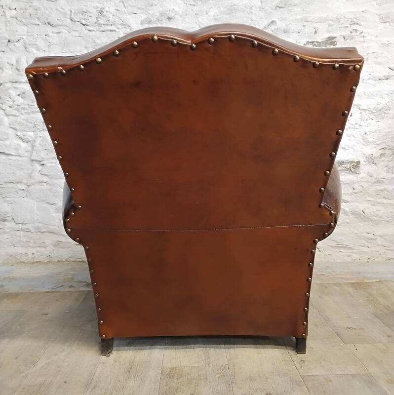 Club chair with moustache back and lion feet.