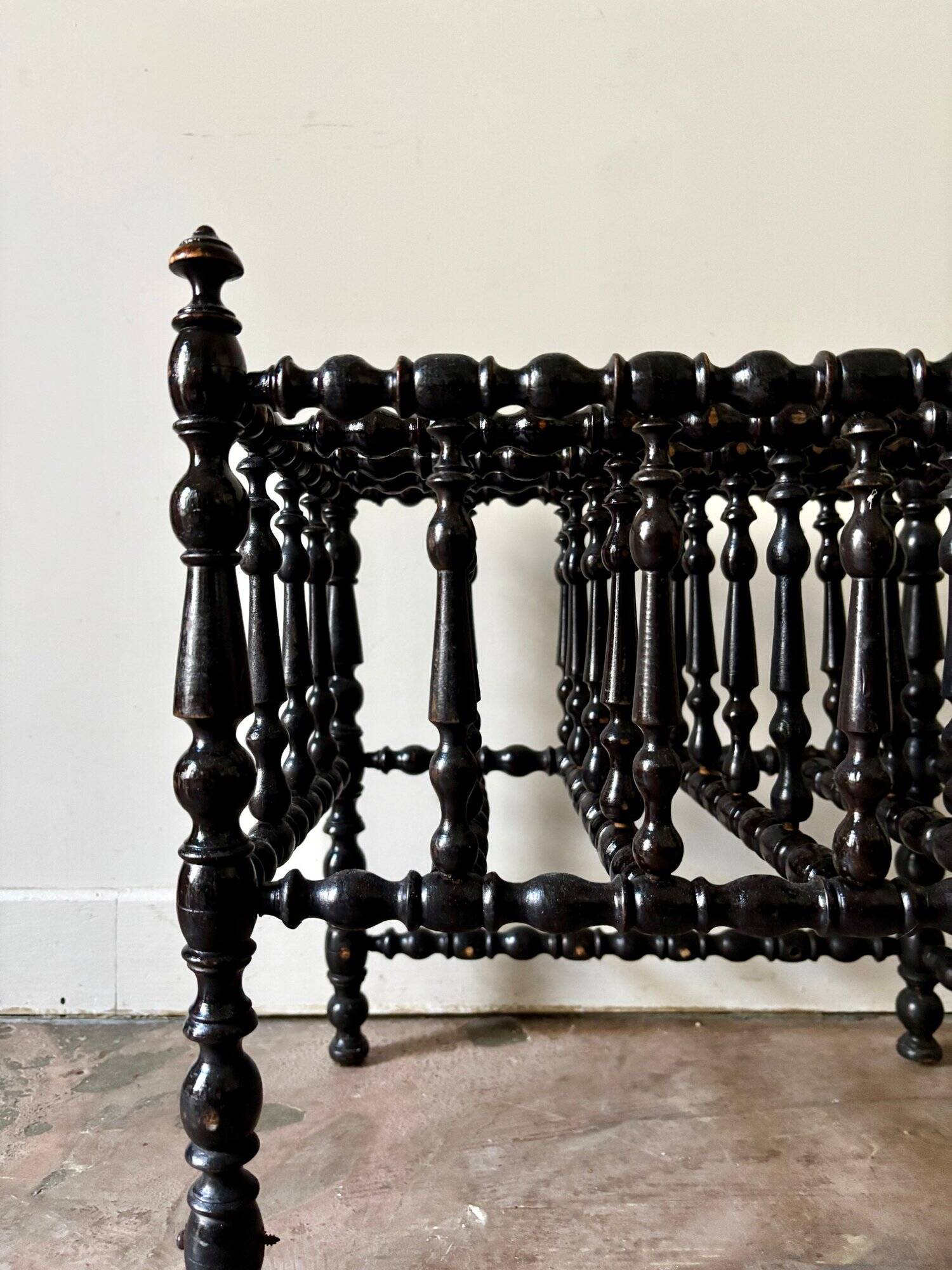 Napoleon III magazine rack in black turned wood