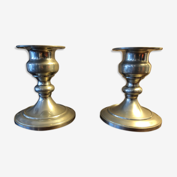 Duo of old tin candlesticks