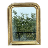 Miroir Louis Philippe en bois doré à frise ajourée glace au mercure