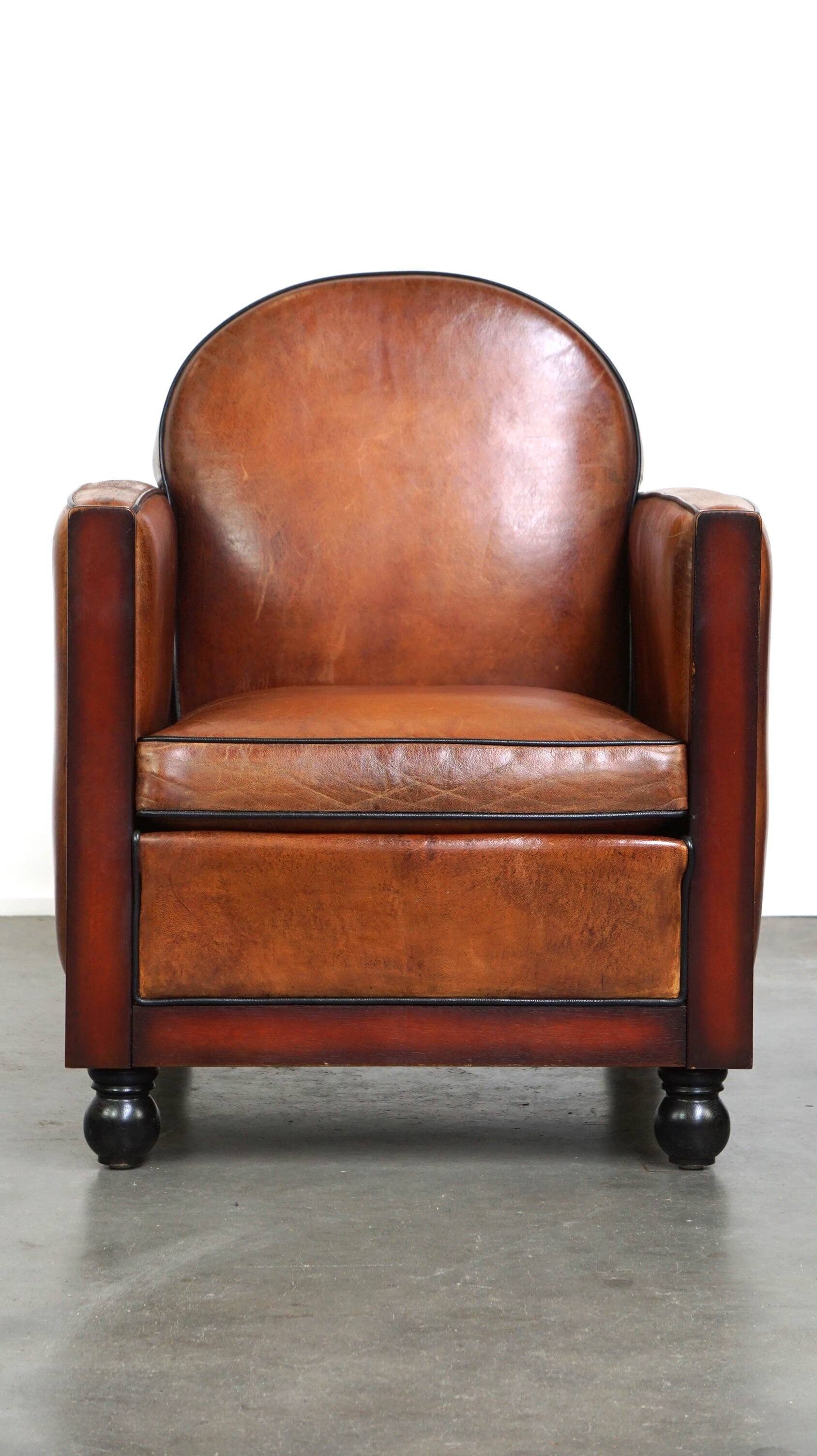 Sheepskin Art Deco design armchair with wood and beautiful cognac-colored leather