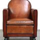 Sheepskin Art Deco design armchair with wood and beautiful cognac-colored leather
