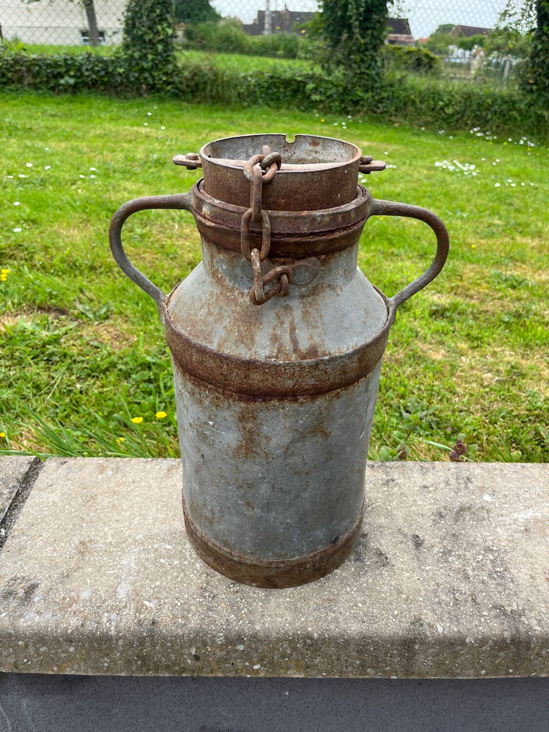 Old metal can or milk jug