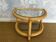Two-tiered twisted rattan accent table with glass shelves, 1970s