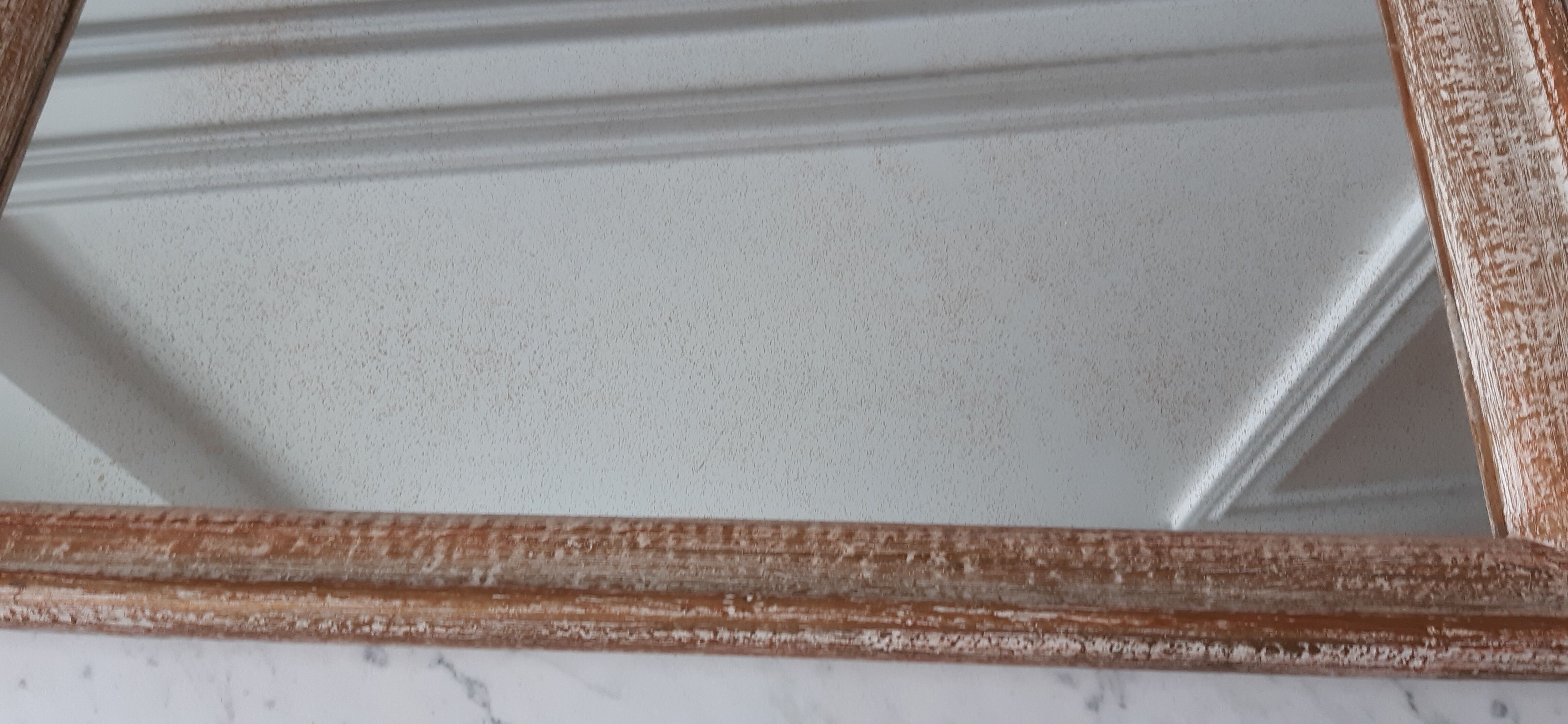 Mirror to be placed or hung in gilded wood