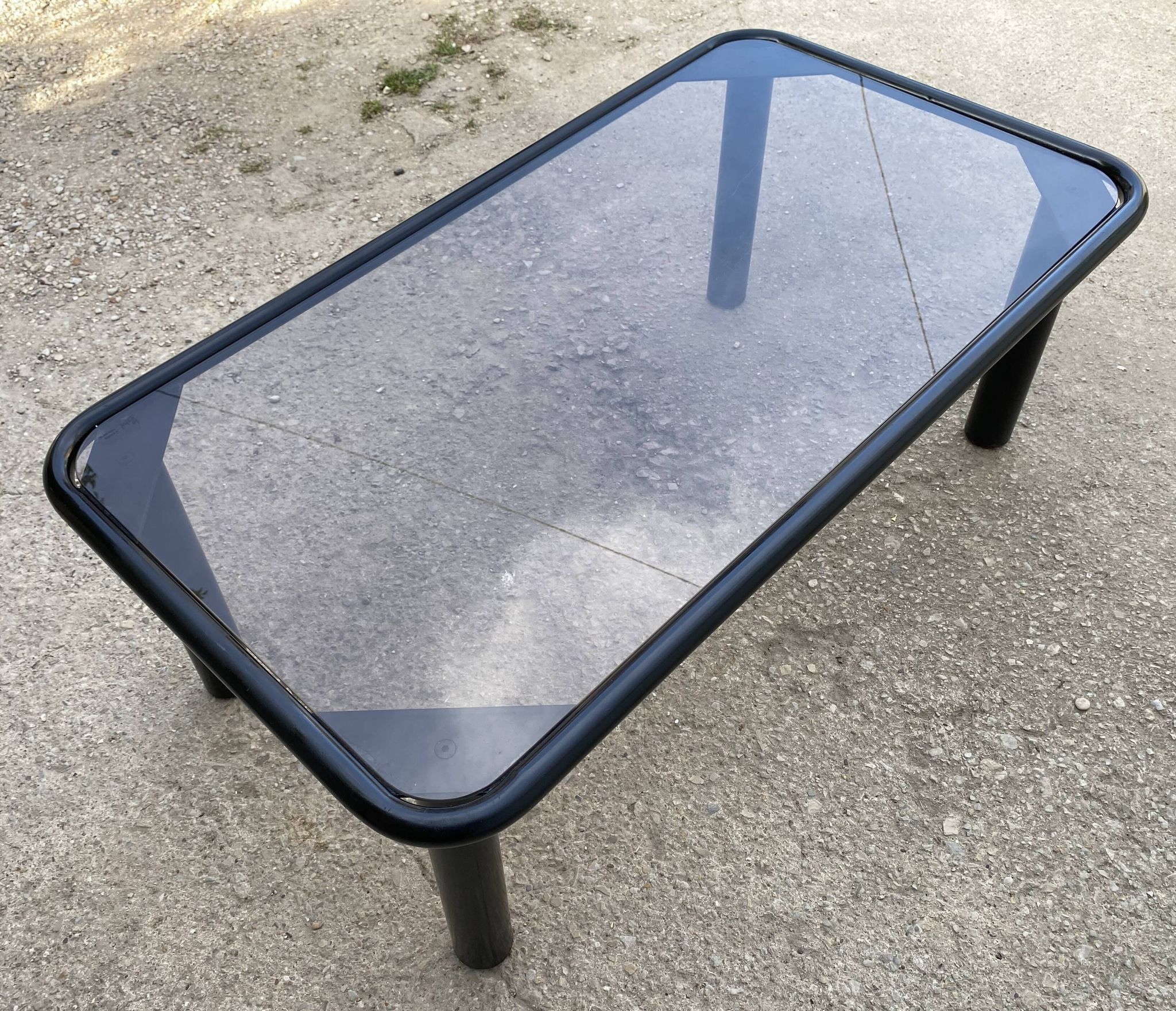 Vintage black tubular coffee table with smoked glass by Yves Boutboul, 1980.