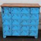 Old blue metal locker with wooden top