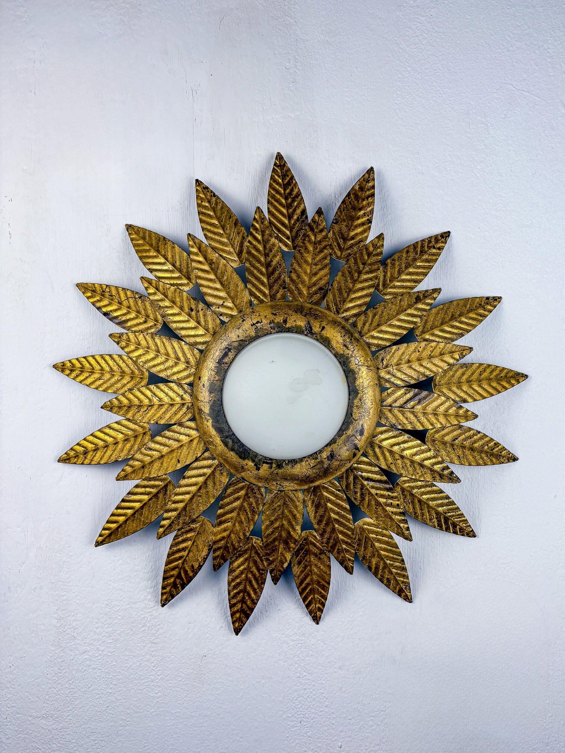 Flower sunburst ceiling light fixture, gold leaf gilt iron & milk glass, Spain, 1950s