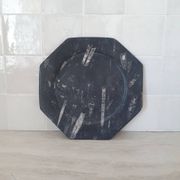 Decorative plate made of fossilised orthoceras marble.