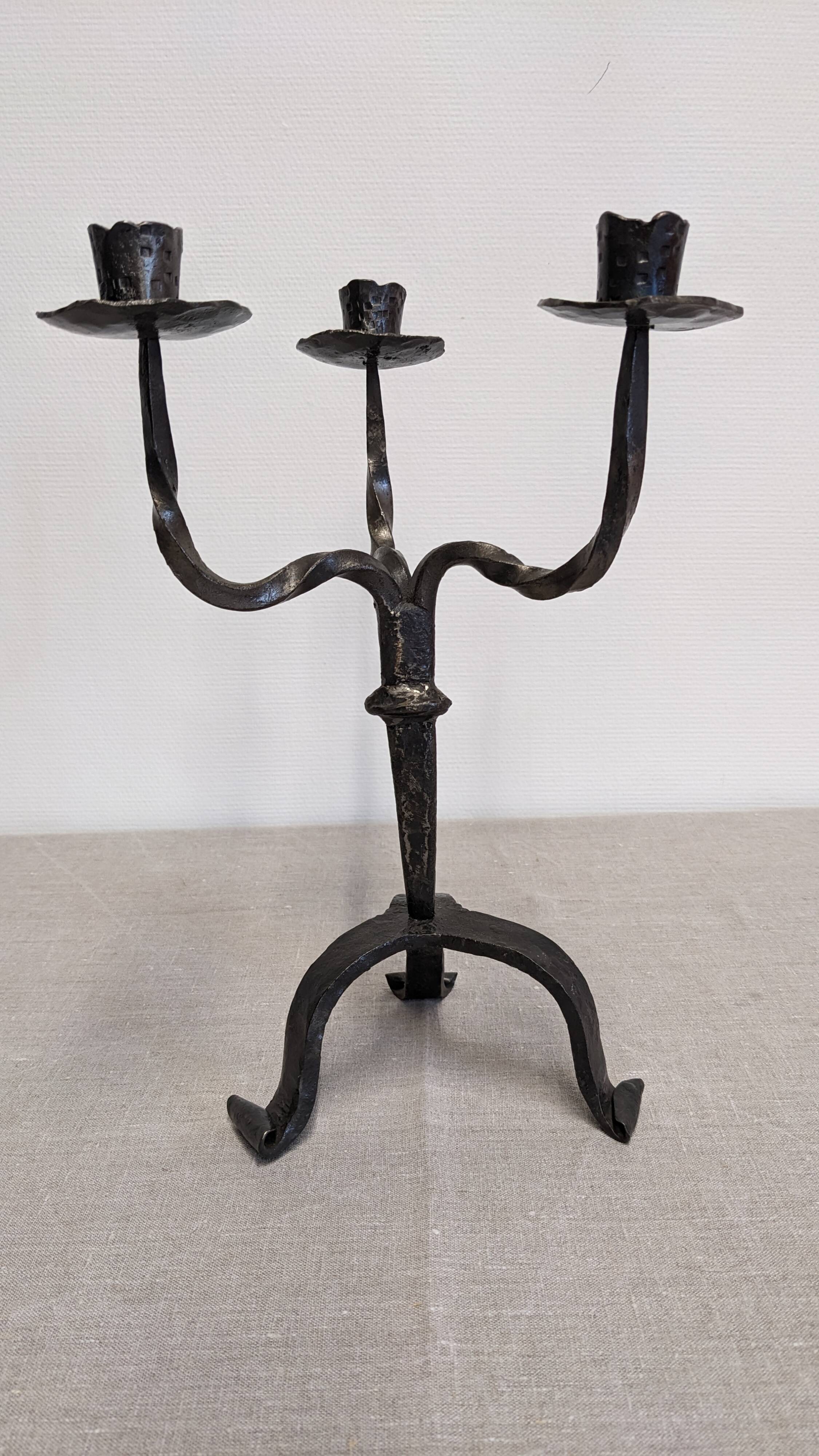 Brutalist candelabrum with 3 lights in wrought iron, France circa 1950.