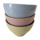 Set of three pastel two-tone mini bowls in glazed ceramic.
