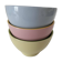 Set of three pastel two-tone mini bowls in glazed ceramic.