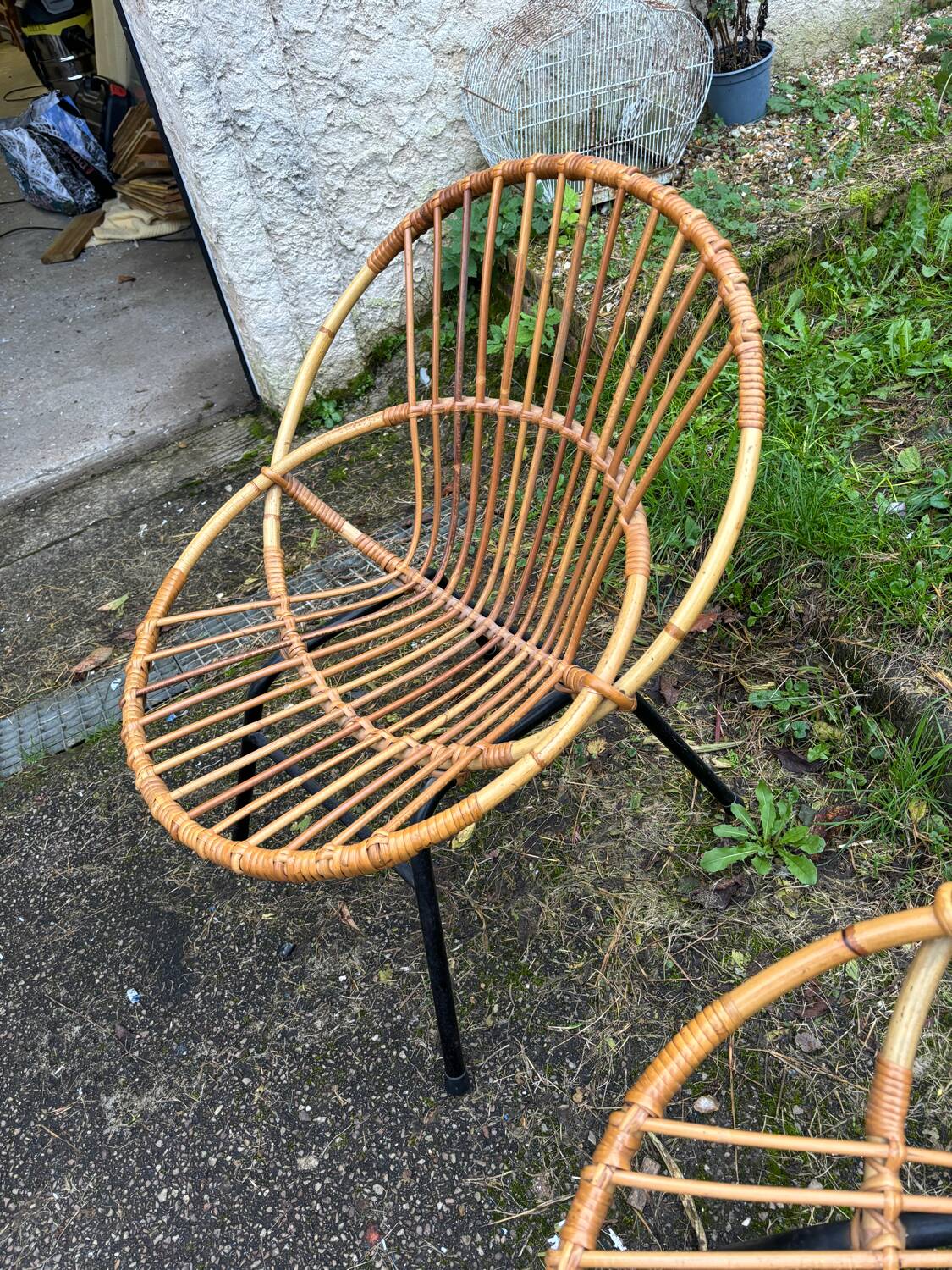 Vintage rattan armchair with metal legs