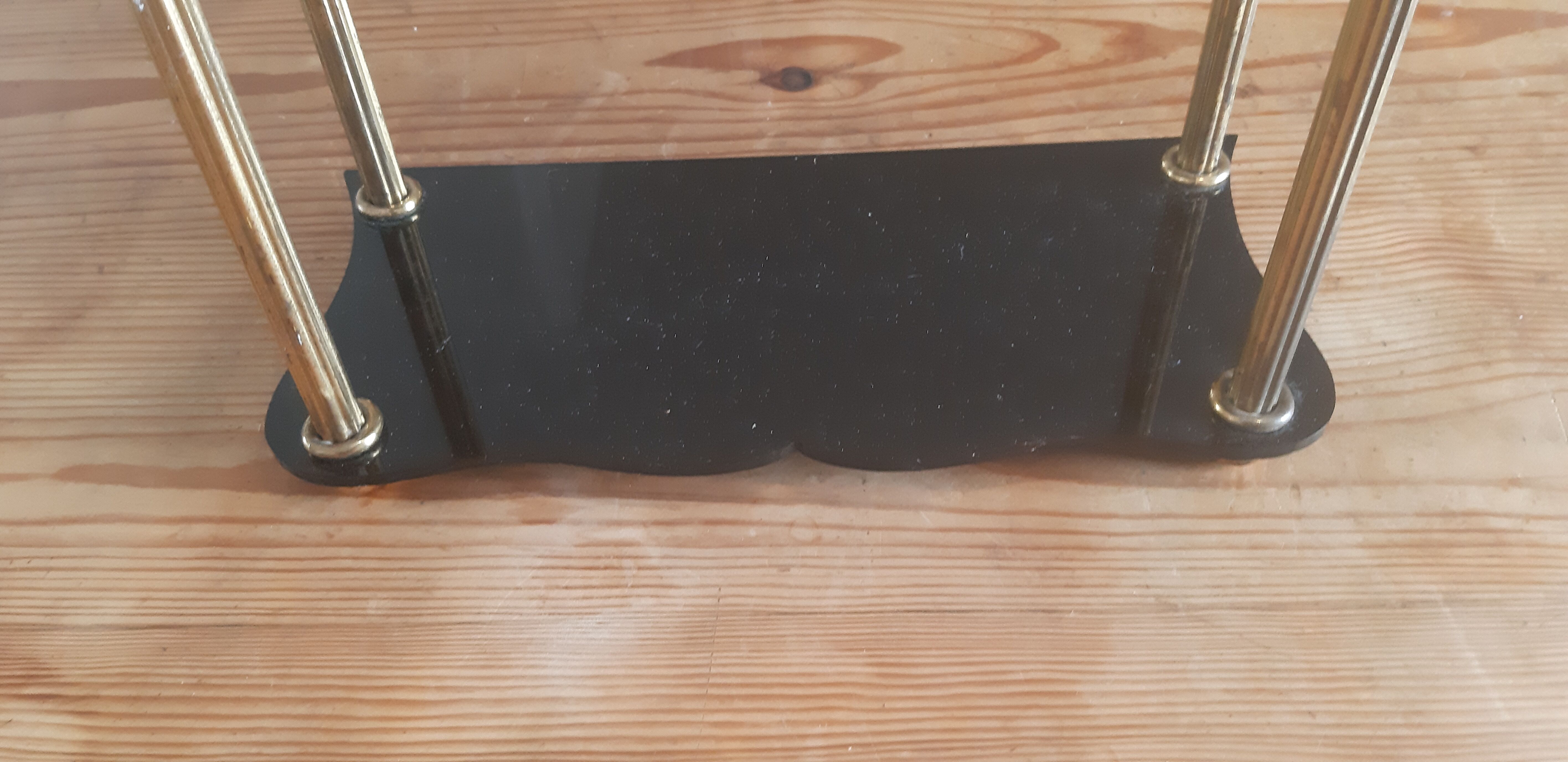 Vintage shelf of the 60s in golden metal and black plastic