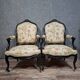 pair of Louis XV style armchairs, in moulded and carved wood, lacquered black