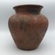 Vase or pot in brown terracotta with artistic decoration of fish.