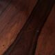 Round table in varnished rosewood