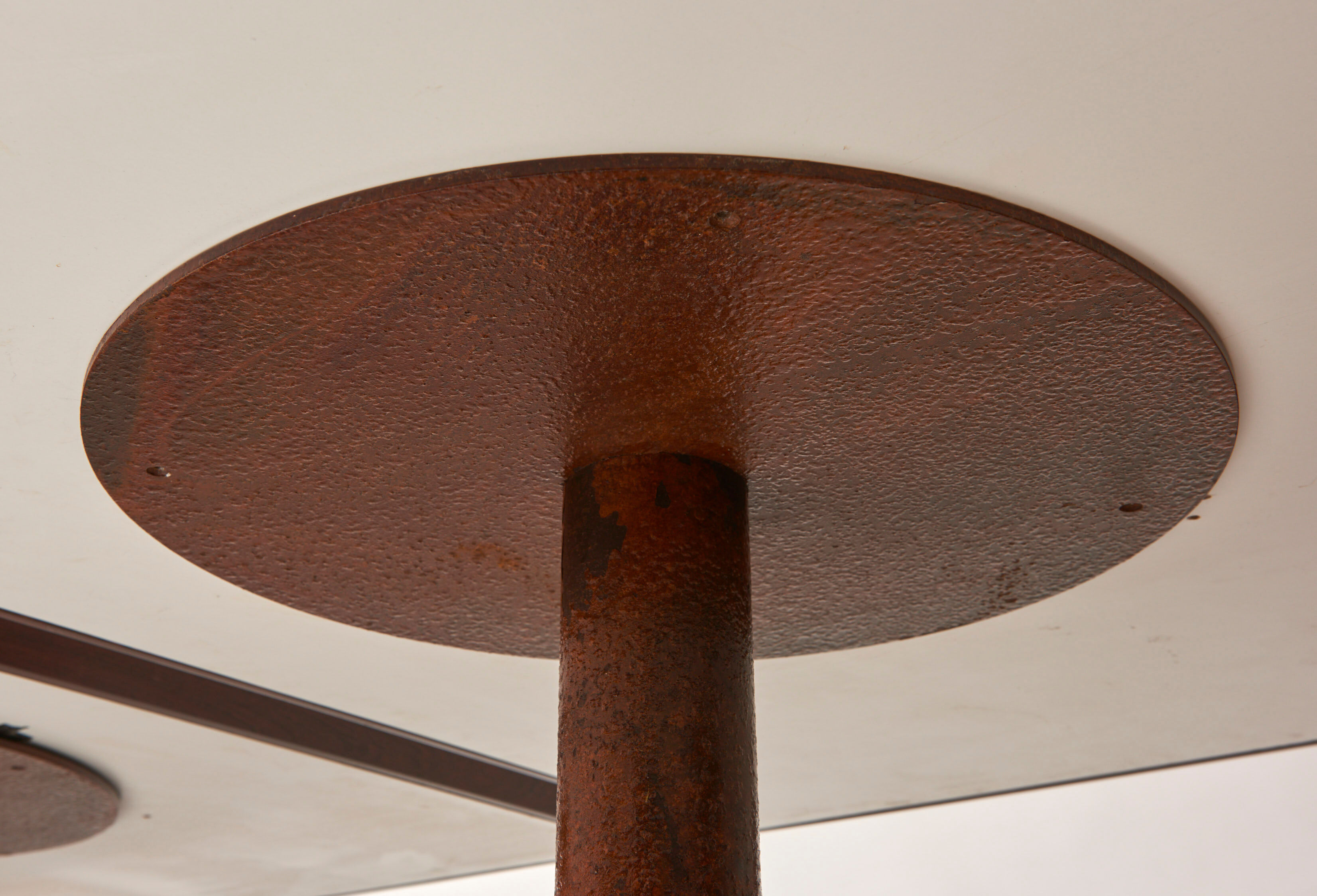 Brutalist conference table made of wood and steel