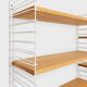 Tomado wall unit with wooden shelves by A. Dekker