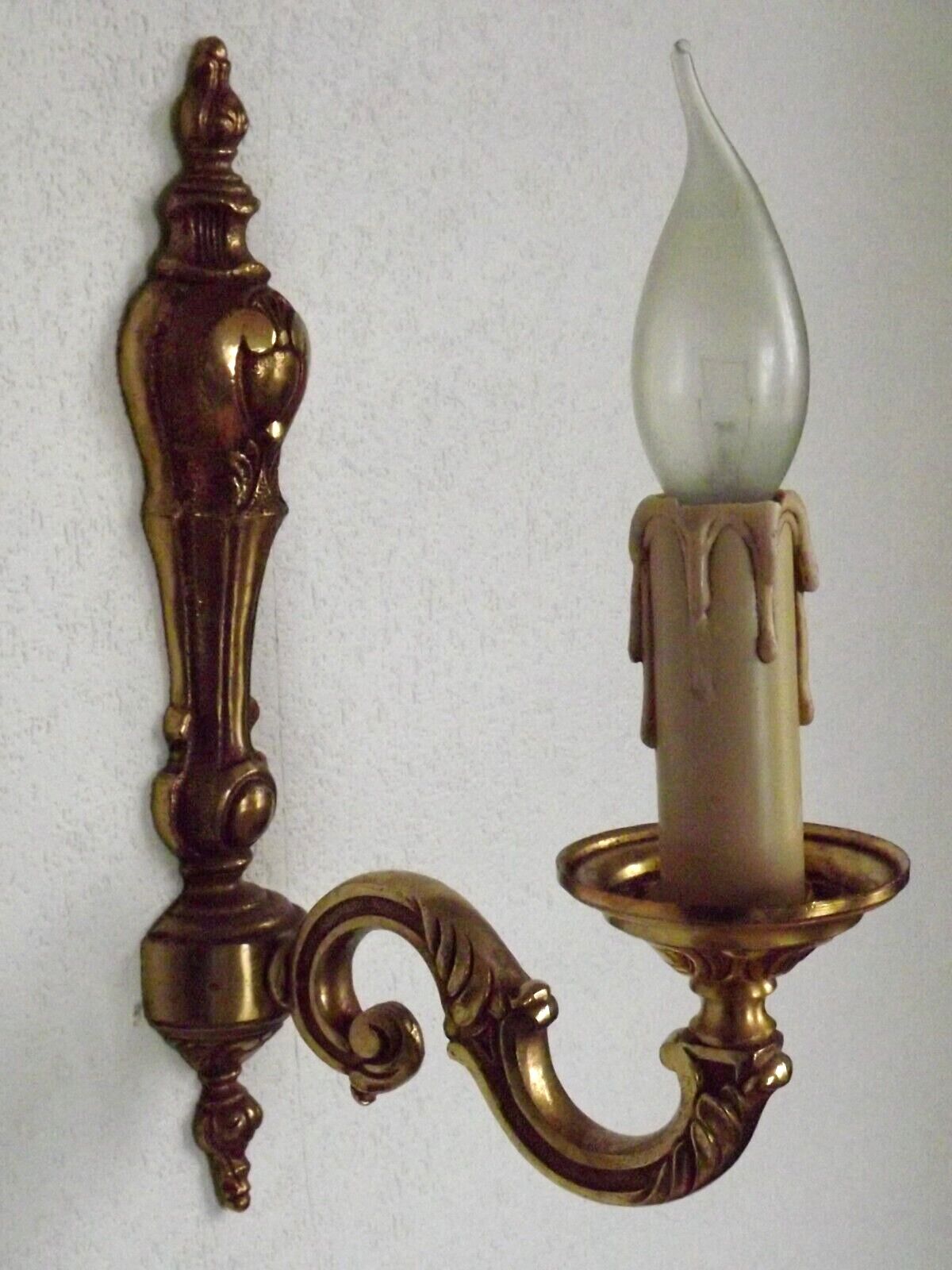 Simple wall sconce in classic Empire style in vintage French bronze.