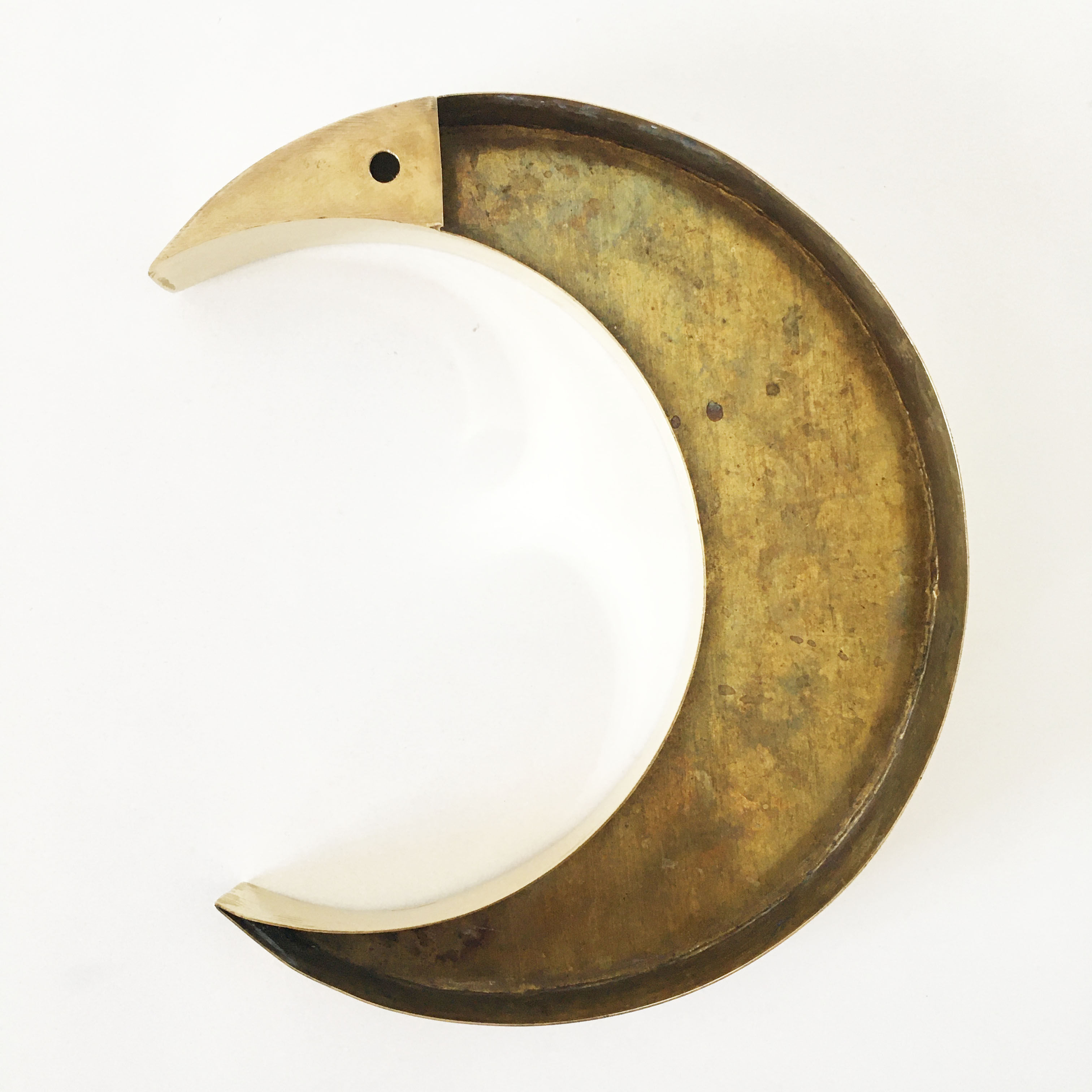 Moon or letter of sign "C" in vintage brass