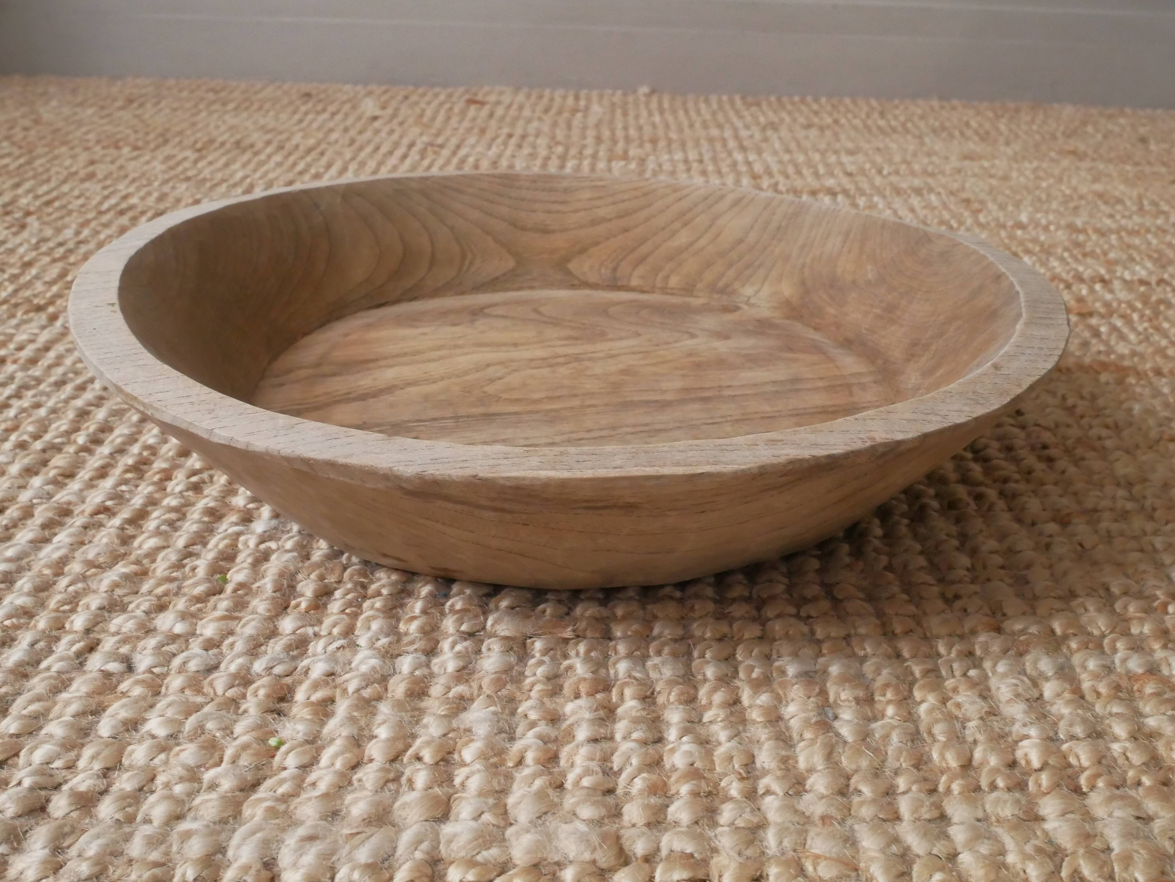 Raw wooden dish carved in the mass ethnic African art handmade artisanal manufacturing
