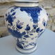 Ceramic vase earthenware, blue floral decoration on a white background