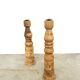 Pair of turned wooden candlesticks, raw and waxed.