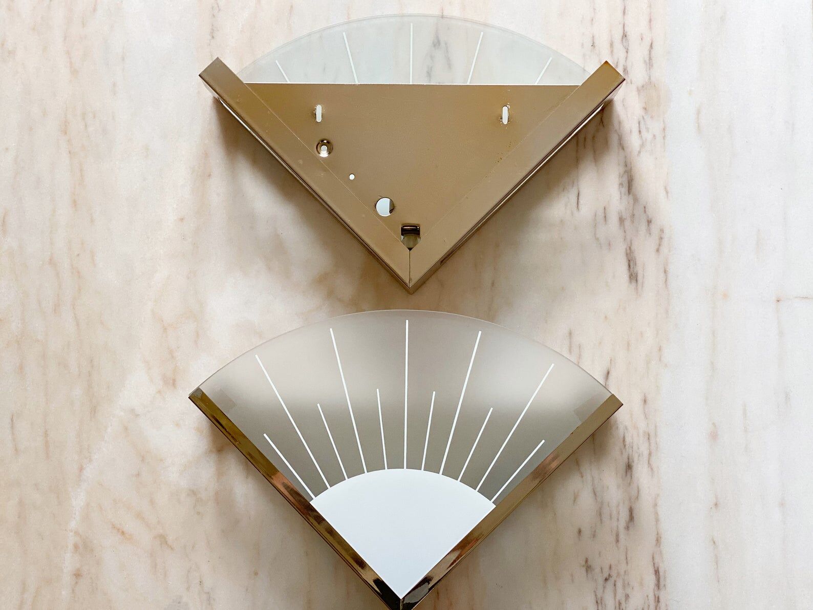 A pair of 80s hollywood regency glass & brass wall lamps
