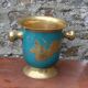 Vintage turquoise brass champagne bucket with grape decoration.