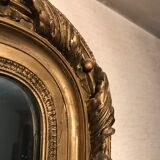 Large antique mirror with flagship shell in wood and gilded stucco