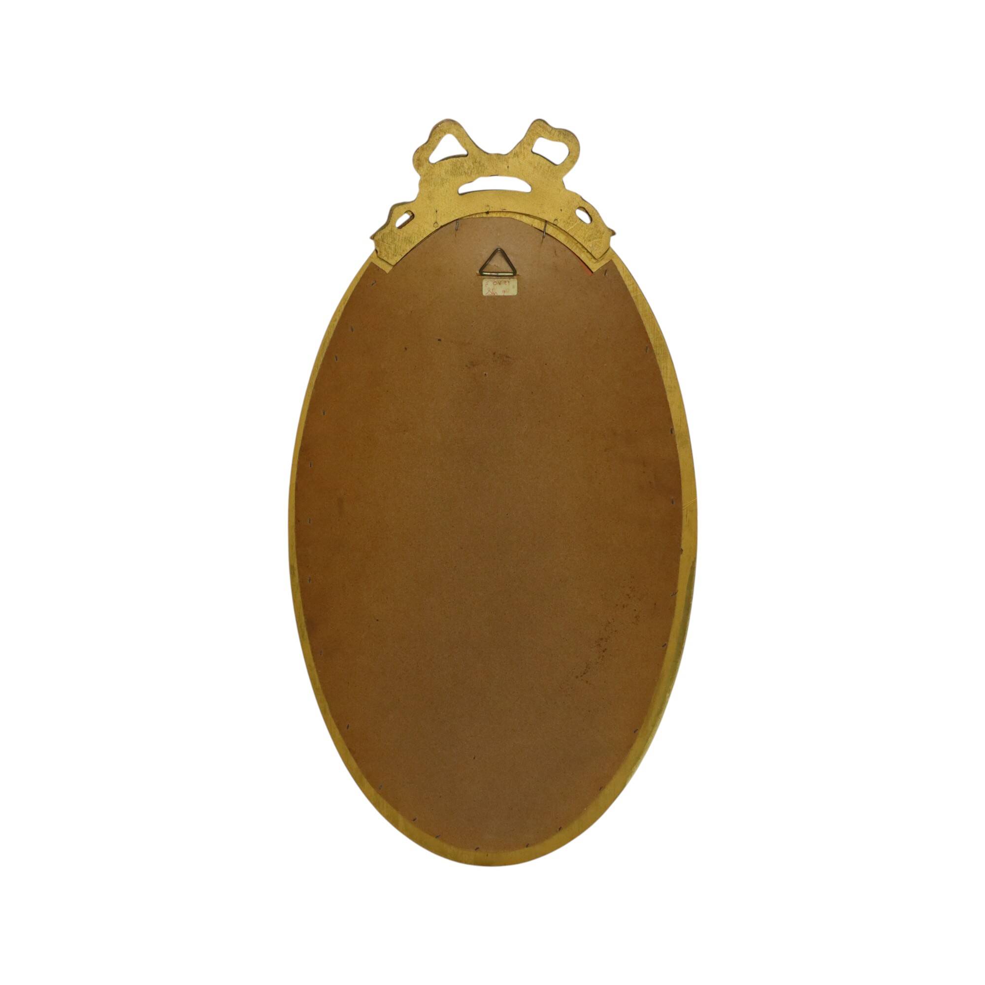 Miroir ovale classique doré à décor de ruban, France