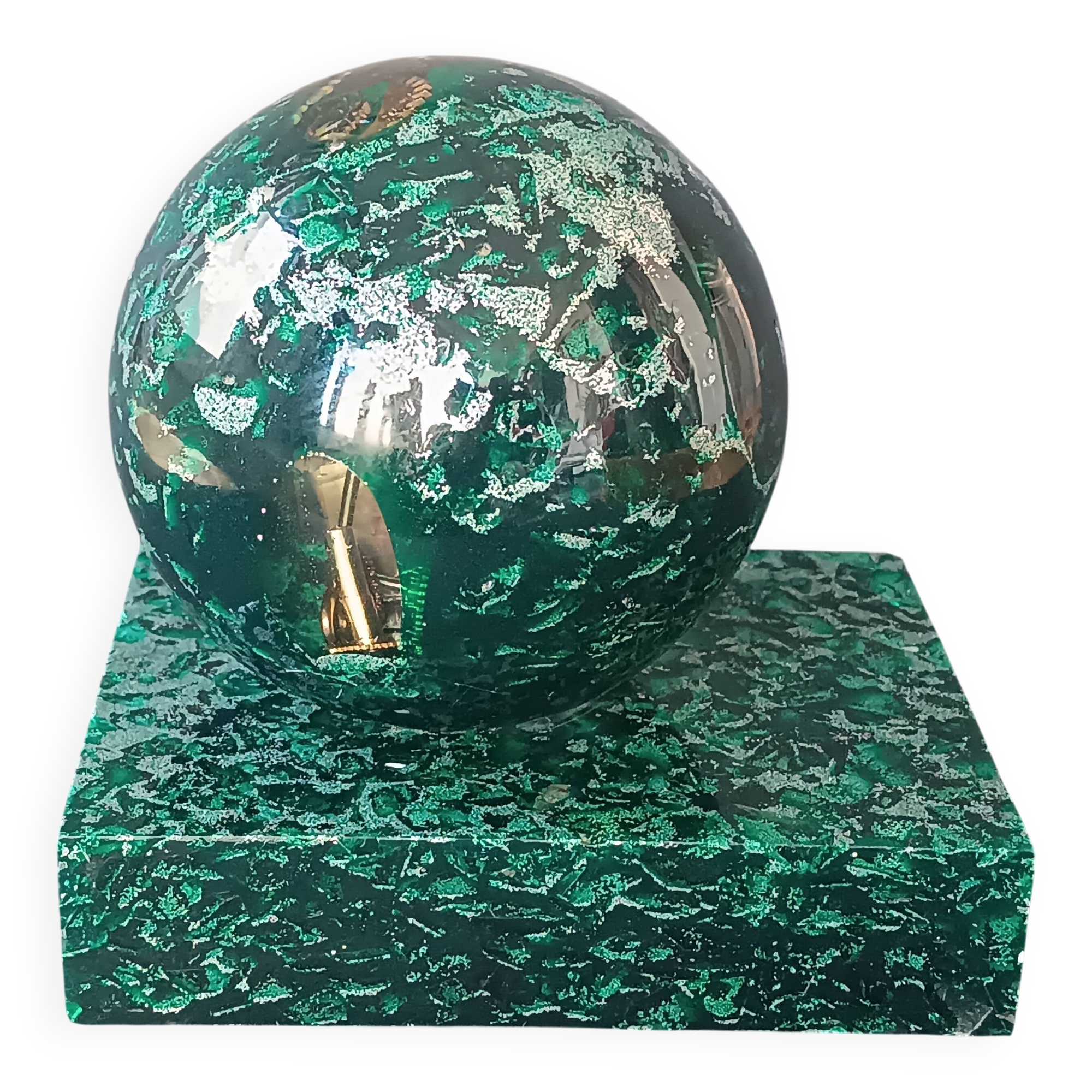 Design bookends in fractal resin with watchmaking inclusions.